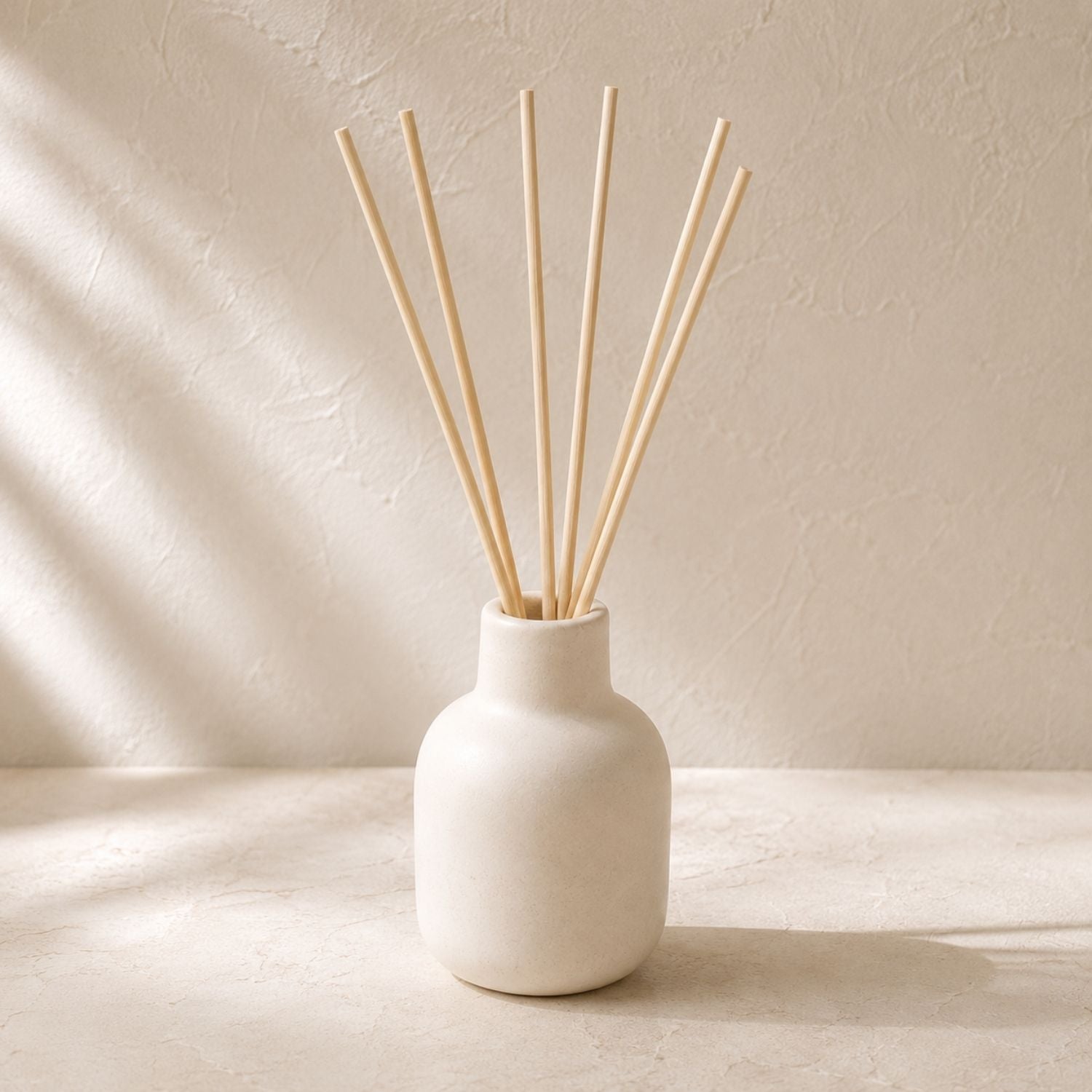 Diffuser vessel styled with plain diffuser reeds
