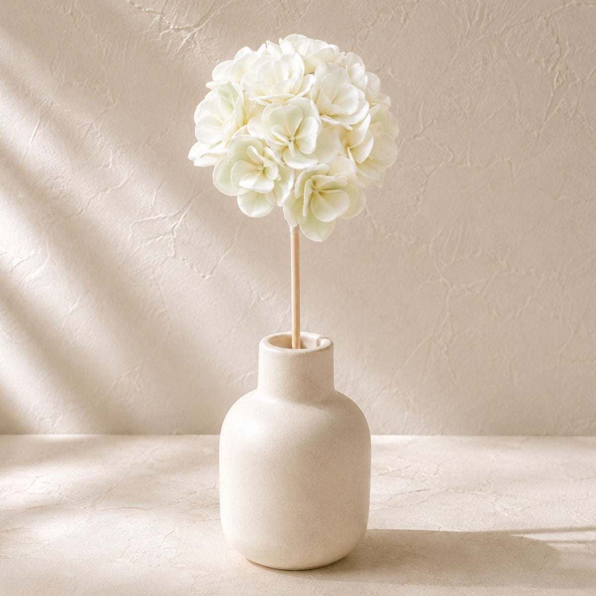 Same diffuser vessel styled with one Hanazora flower-ball reed