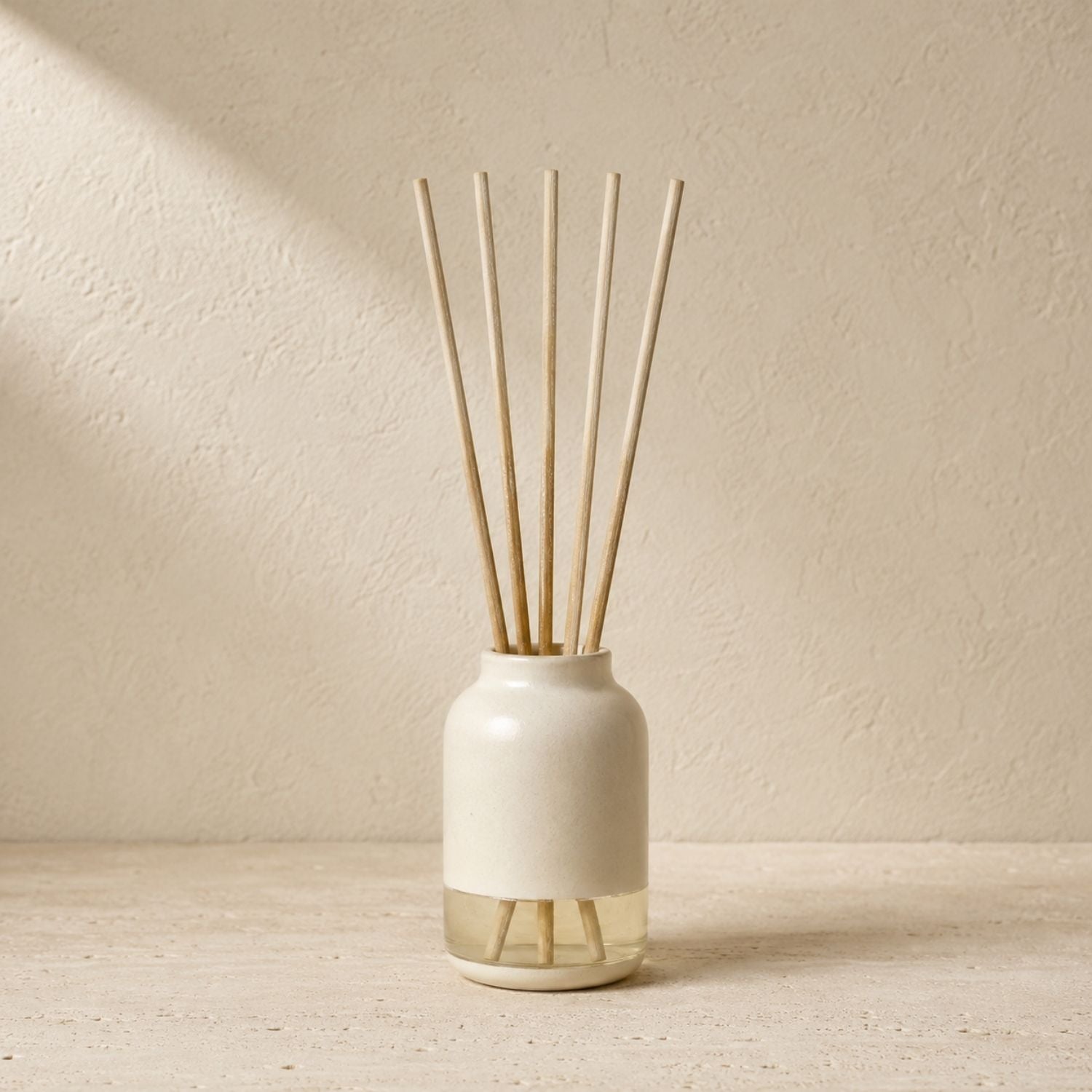 Diffuser vessel styled with plain diffuser reeds