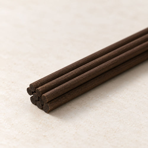 Close-up of five Deep Brown manufactured fibre reed ends